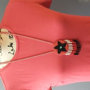 Artisan Crafted Beaded Necklace with Red, Black, and White Accents